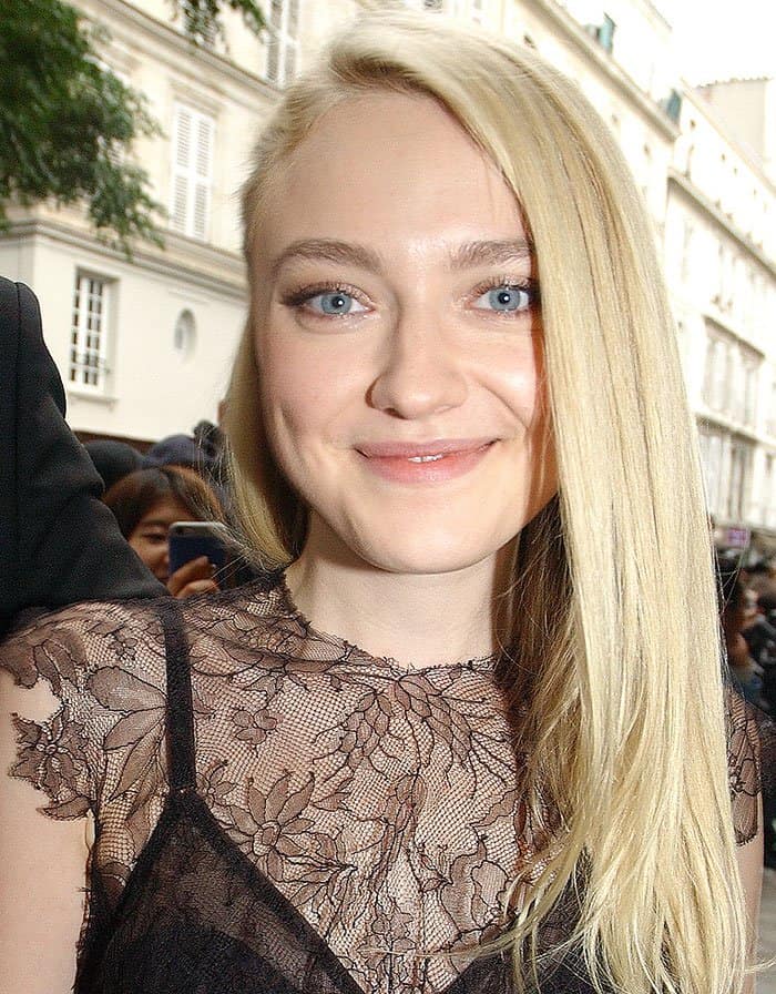 Dakota Fanning pinned her straightened tresses to one side