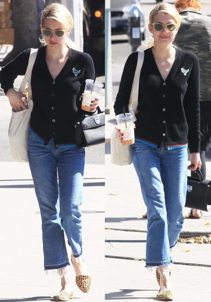 Emma Roberts kept it effortlessly chic on her Beverly Hills coffee run, pairing a playful Rexy-patch Coach cardigan and cropped GRLFRND jeans with leopard-print Loeffler Randall “Prue d’Orsay” flats, a Dior mini “Diorever” bag, and retro-inspired Garrett Leight x Clare V. sunglasses