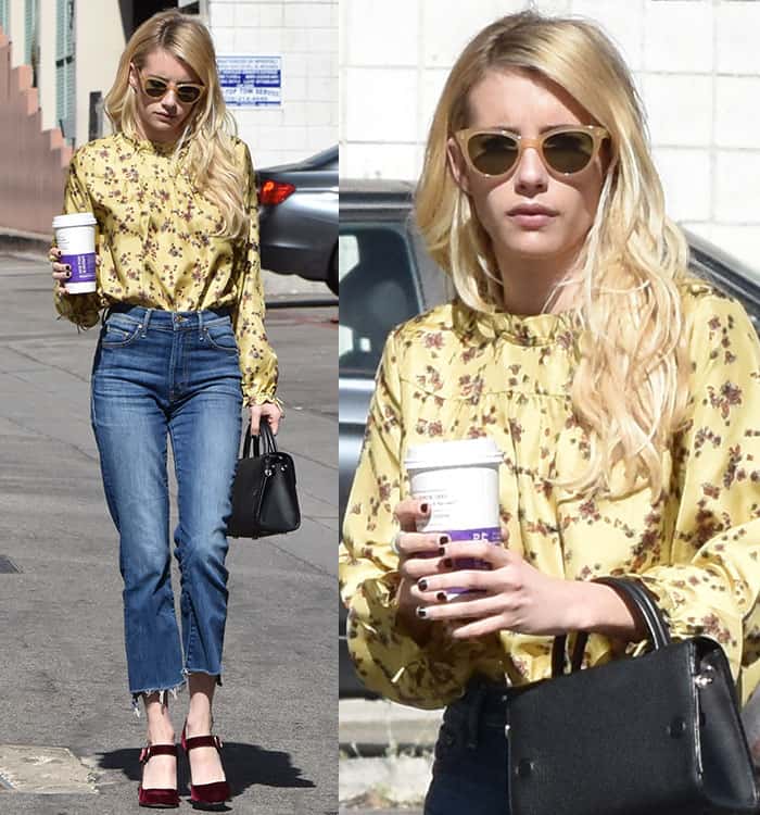 Emma Roberts steps out in Beverly Hills in a chic floral blouse, frayed jeans, velvet Mary Jane heels, and classic sunglasses, completing the look with a structured black handbag and a coffee in hand