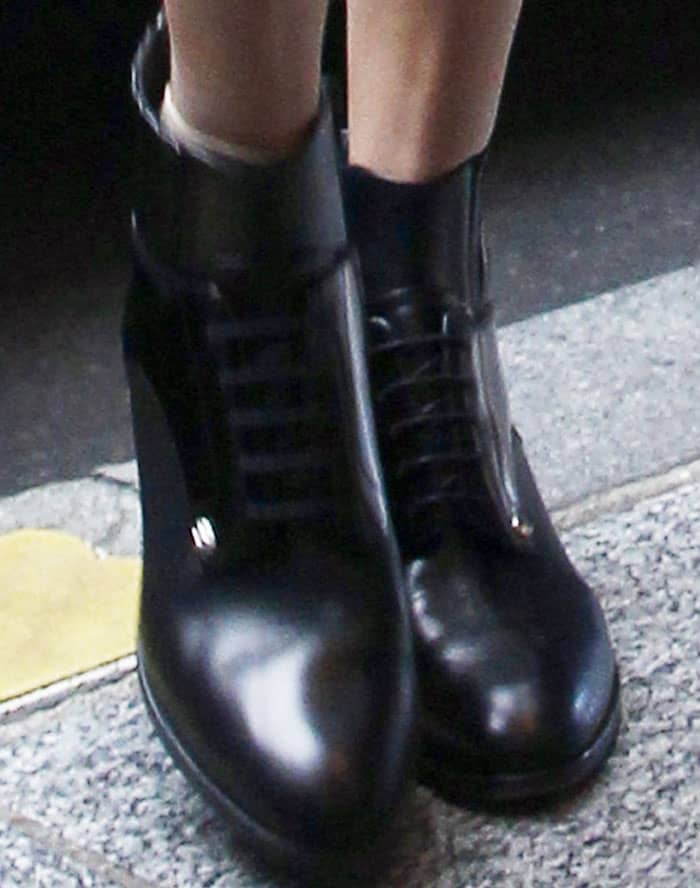 Gigi Hadid wore her Versus Versace boots, which she was last seen in during London Fashion Week