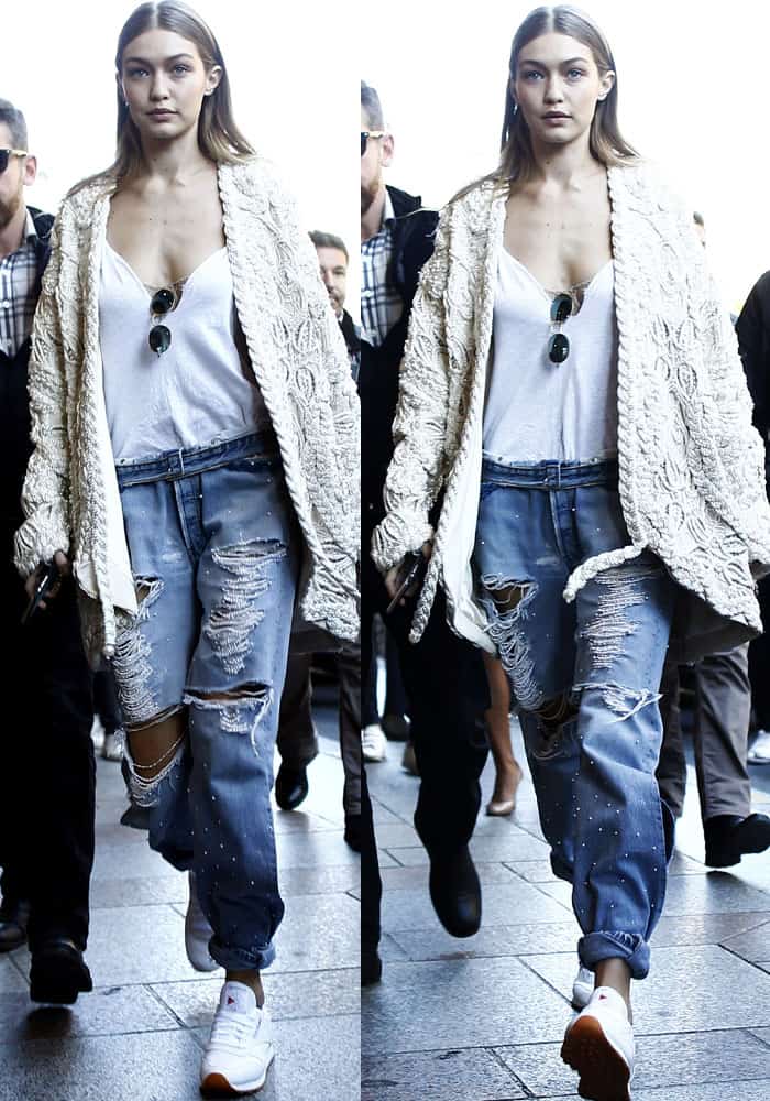 Gigi Hadid wears pearls with her casuals as she steps out of the Miu Miu show in Paris