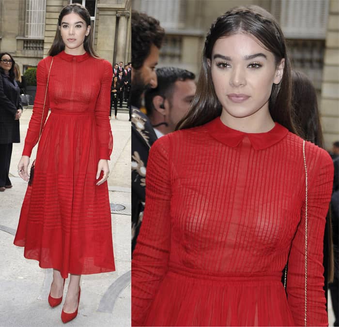 Actress Hailee Steinfeld looked stunning in a rich red Valentino dress featuring a delicate Peter Pan collar, fitted long sleeves, and a pleated, mid-length skirt, perfectly matched with bold red pumps at the Valentino show as part of the Paris Fashion Week Womenswear Spring/Summer 2017 on October 2, 2016, in Paris, France