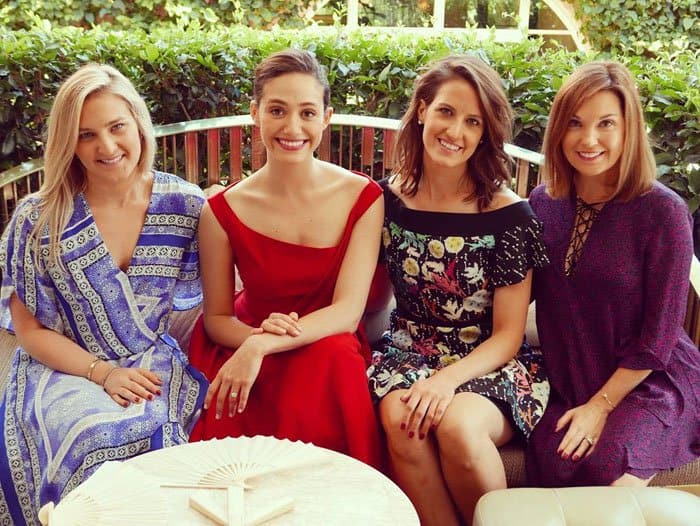 Emmy Rossum radiates elegance in the same red Preen "Finella" dress as she celebrates her bridal shower with friends