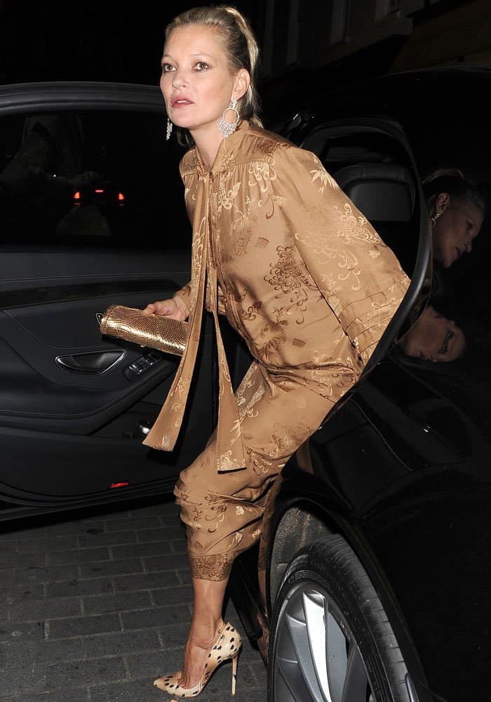 Katt Moss's dress featured oriental-inspired metallic prints that shimmered under the right lighting