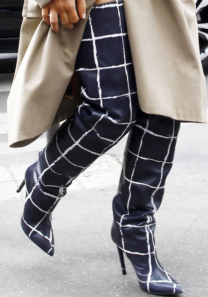 Kim Kardashian stepped out in printed thigh-high Balenciaga boots