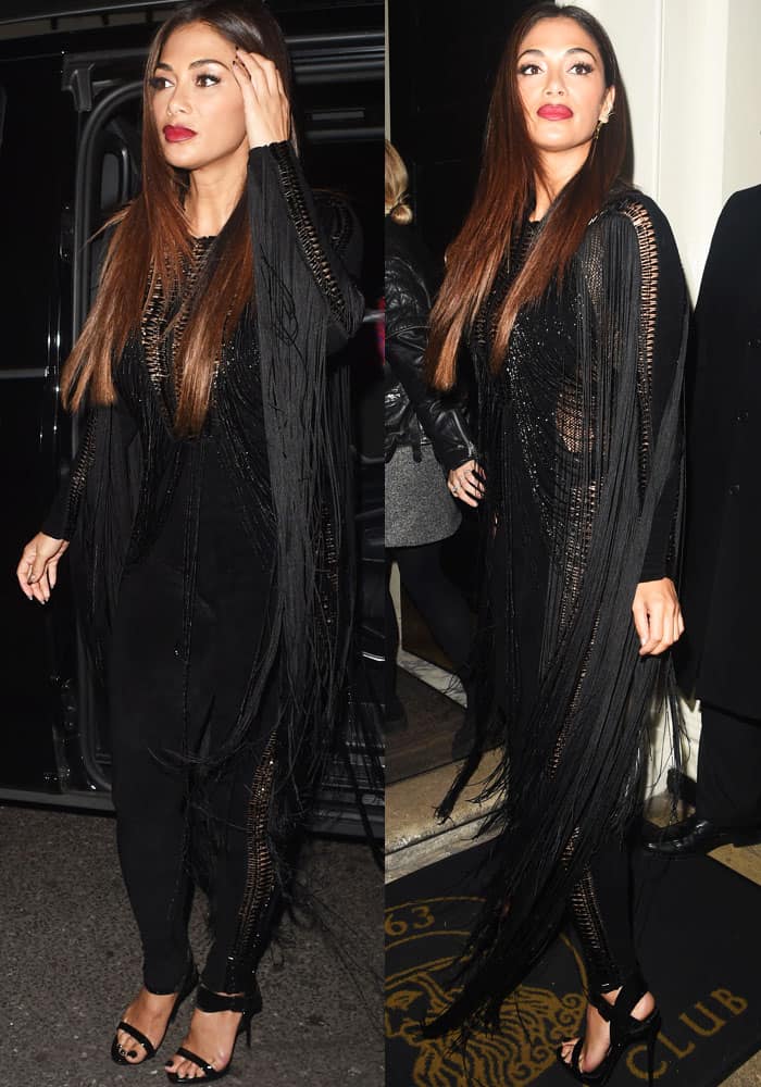 Nicole Scherzinger stuns in a fringed black Julien Macdonald jumpsuit paired with strappy Giuseppe Zanotti sandals while arriving at The Arts Club in London to celebrate Sharon Osbourne's birthday