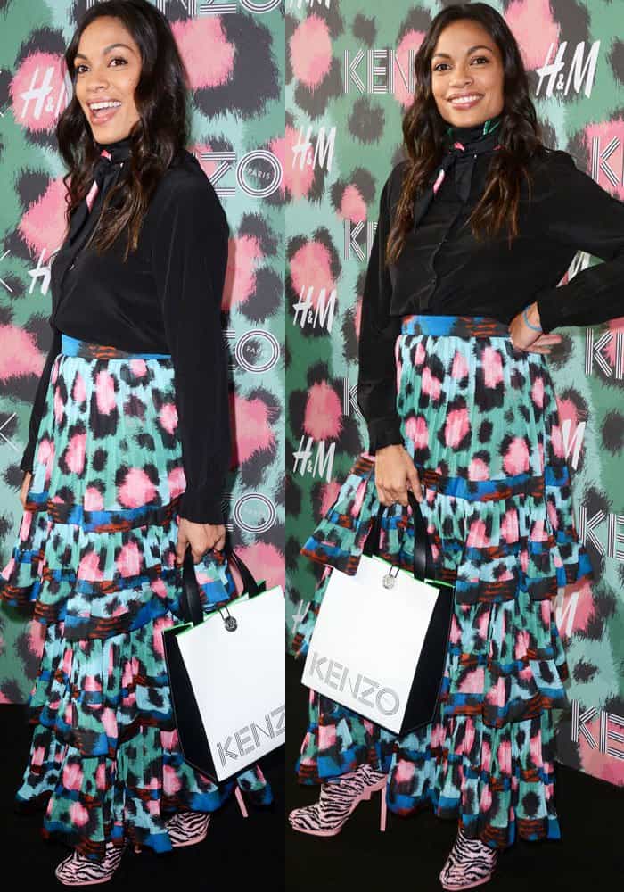 Rosario Dawson turns heads in bold pink zebra-striped sock boots and a colorful ruffled maxi skirt at the HM x Kenzo launch in New York on October 20, 2016