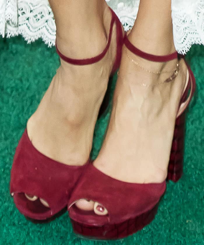 Via Spiga's burgundy suede "Varsha" platform sandals added a contemporary edge to Vanessa Hudgens' romantic Zimmermann ensemble, balancing bohemian softness with a more structured silhouette