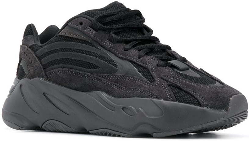 Kim Kardashian wore black adidas YEEZY Boost 700 V2 "Vanta" sneakers featuring a mesh base with all overlays in suede, as well as detailing in a reflective film for a touch of flash
