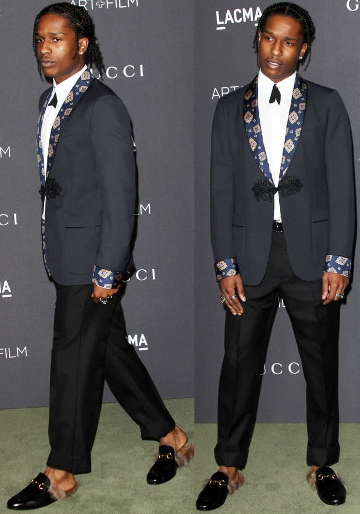 A$AP Rocky makes a bold fashion statement at the LACMA Art+Film Gala, pairing a navy Gucci suit with a patterned lapel, sleek black bow tie, and luxurious fur-lined Gucci Princetown loafers