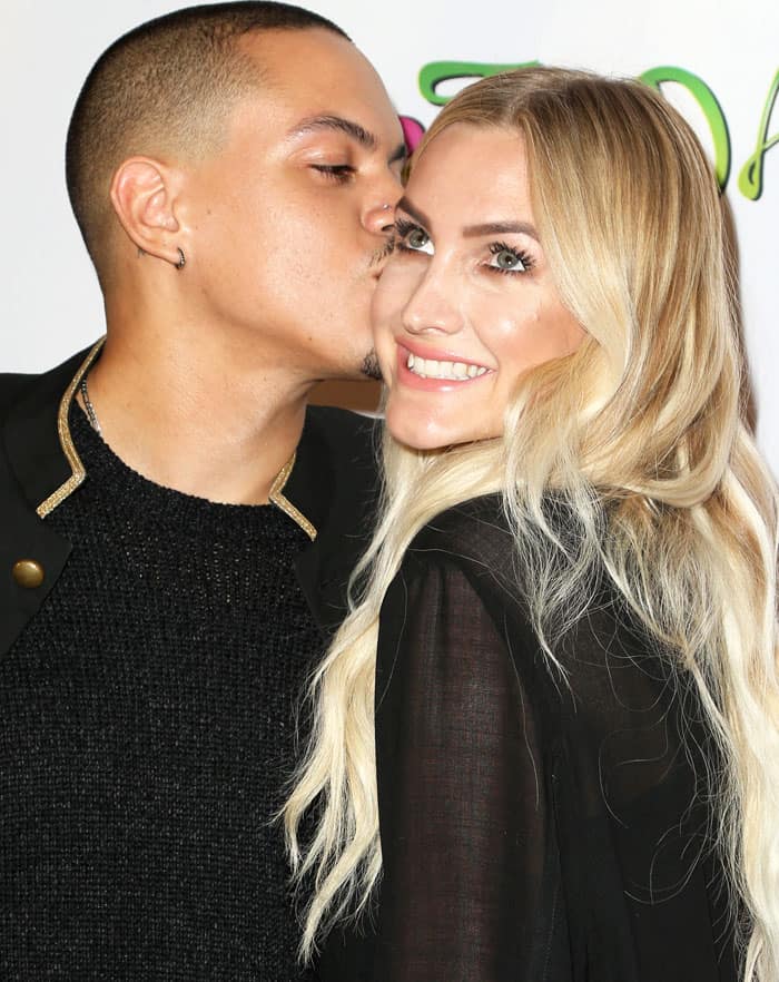 Evan Ross plants a sweet kiss on wife Ashlee Simpson's cheek as they share a loving moment