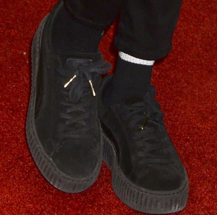 Cara Delevingne paired her HM ensemble with the Puma x Rihanna "Creeper" sneakers in black