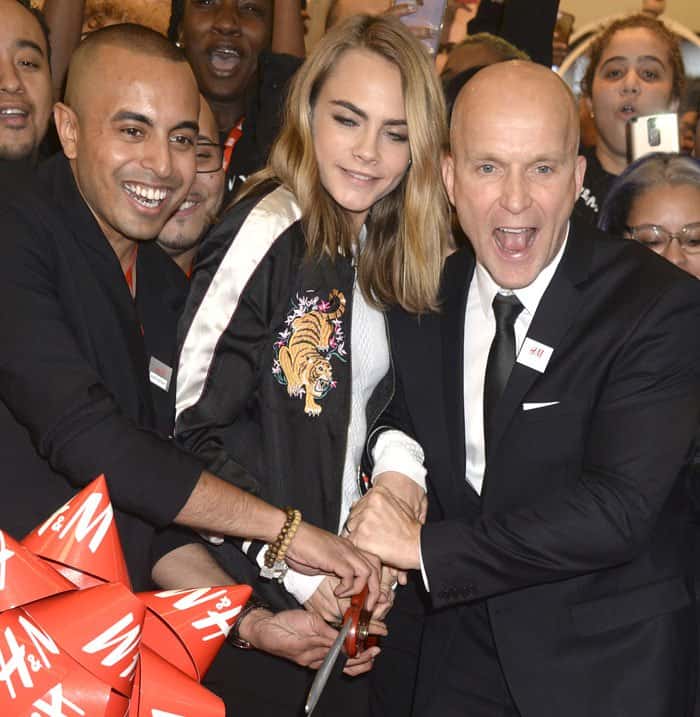 Cara Delevingne enthusiastically cuts the ribbon alongside HM’s North American President, Daniel Kulle, celebrating the grand opening of HM’s Westfield World Trade Center flagship store in New York City