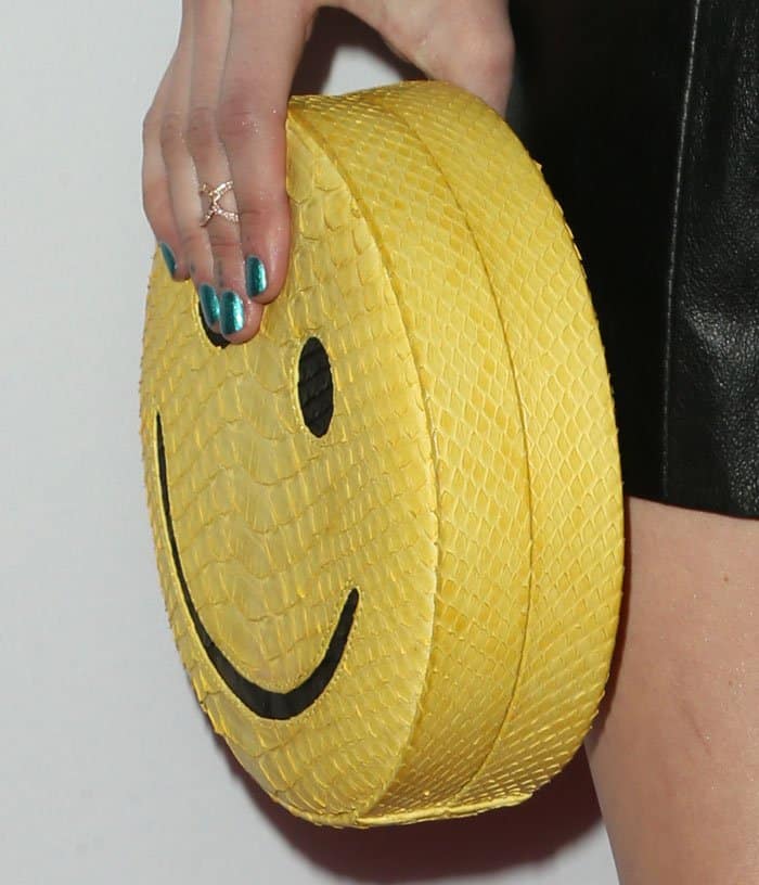 Emma sought the help of a smiley emoji with a Gelareh Mizrahi clutch