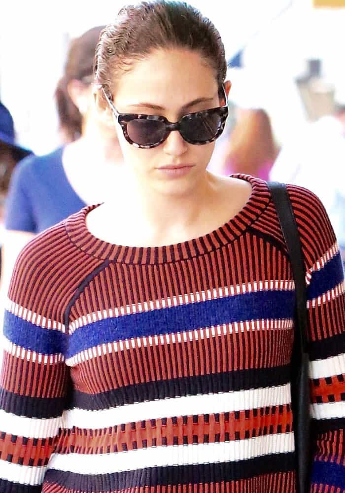 Emmy Rossum steps out in a chic striped Tory Burch "Monterey" sweater, accessorized with sleek tortoiseshell sunglasses for a stylish, casual look