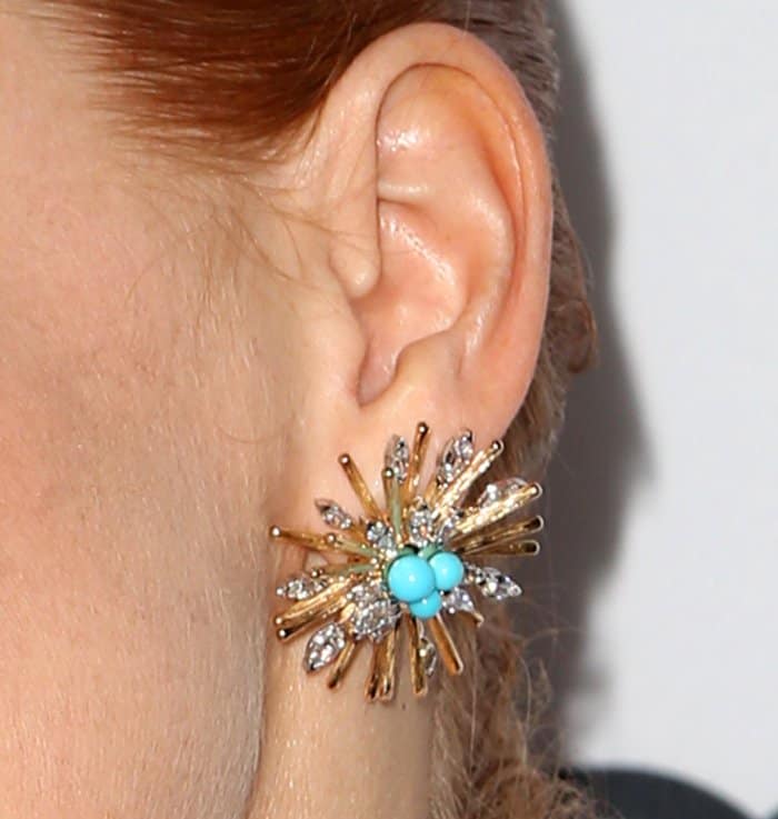Jessica Chastain makes a statement with bold turquoise and gold starburst earrings