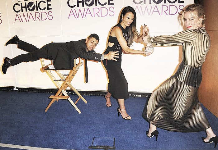 Jordana Brewster playfully battles Wilmer Valderrama and Piper Perabo over a People's Choice Award in a fun backstage moment