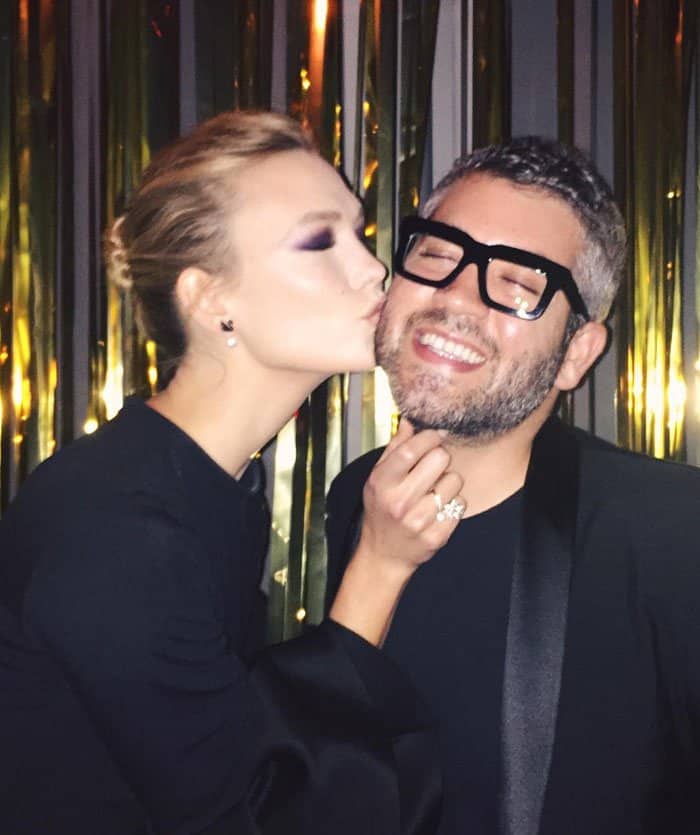 Karlie Kloss playfully shows love to designer Brandon Maxwell with a sweet kiss, capturing their close bond and shared joy
