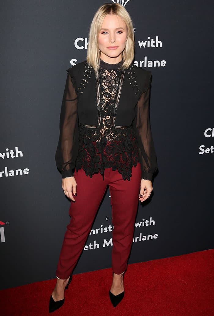 Kristen Bell elevates her burgundy trousers with sleek black pumps, proving that a pointed-toe heel is the perfect way to balance a bold color palette with elegance