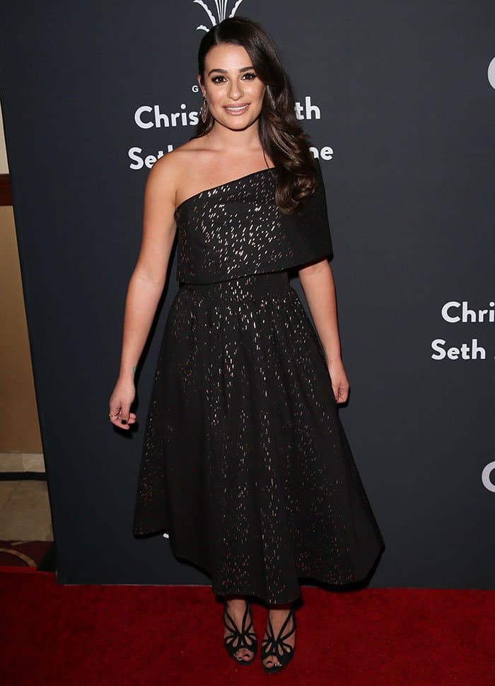 Lea Michele styled her Lela Rose Resort 2017 dress with dangling gold earrings, minimal rings, and soft waves for an effortlessly elegant holiday look