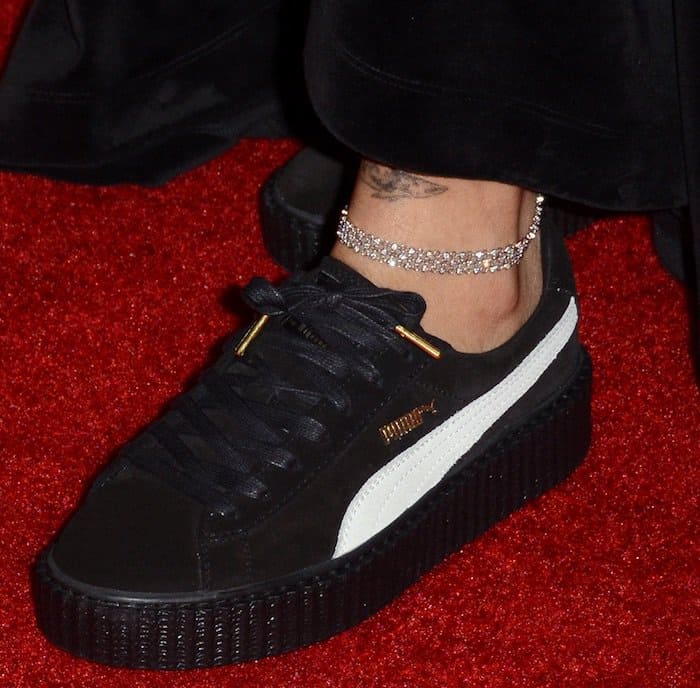 Rihanna adds a touch of sparkle to her look with a diamond anklet paired with her award-winning Fenty Puma Creepers