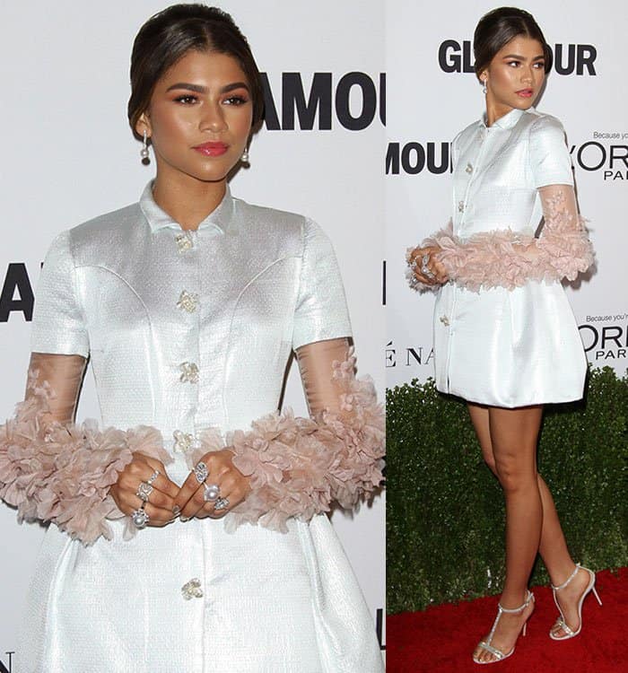 Zendaya's hair is styled in a sleek, low updo, with a center part that complements her elegant and polished look at the Glamour Women of the Year Awards