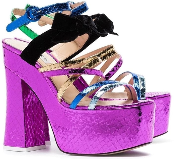 Attico’s Bibbi Greta platform heels combine towering height with playful color-blocked straps and velvet accents, delivering a bold, statement-making silhouette built for maximum impact