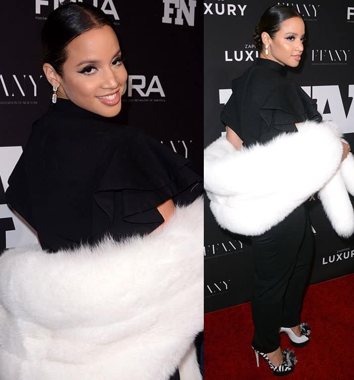 Dascha Polanco stuns in a sleek black jumpsuit paired with a luxurious white fur stole