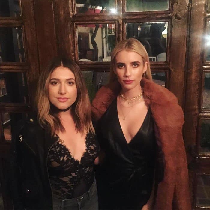 Emma poses with her friend Ally Gasparian before leaving for the event