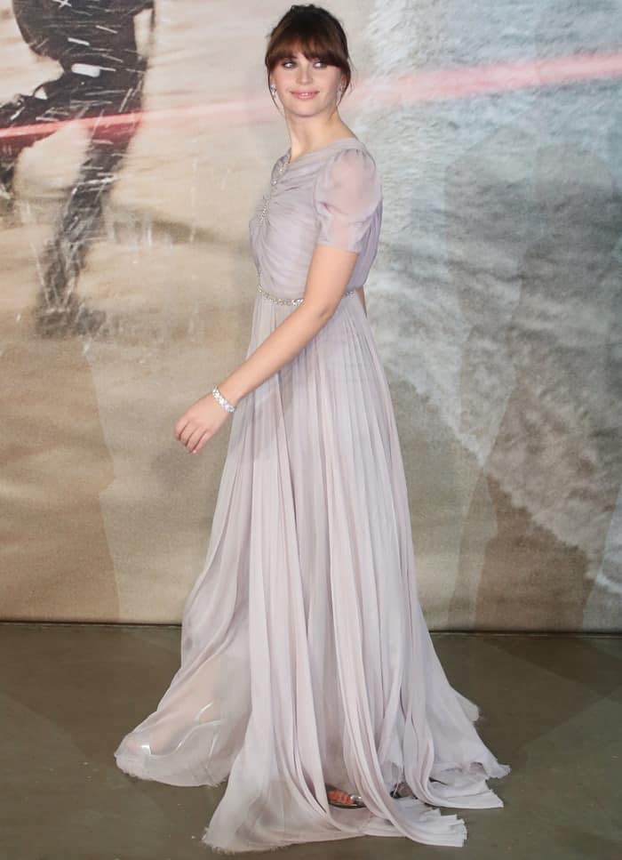 Felicity Jones exuded elegance in a pale lavender Giambattista Valli gown with delicate embroidery and ruched sleeves, paired with silver Giuseppe Zanotti sandals that added a modern touch to her ethereal look