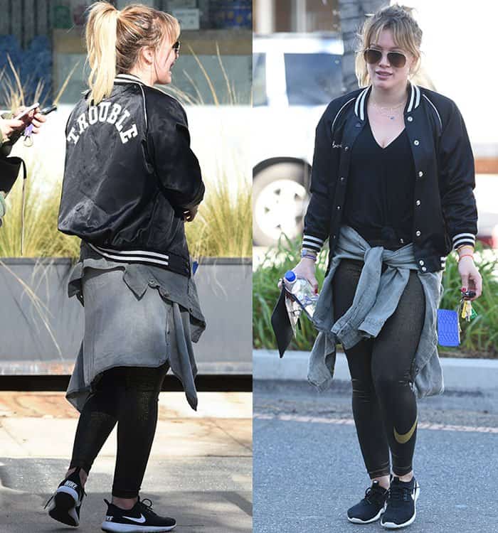 Hilary Duff rocking a casual look with an R13 baseball jacket and Nike leggings