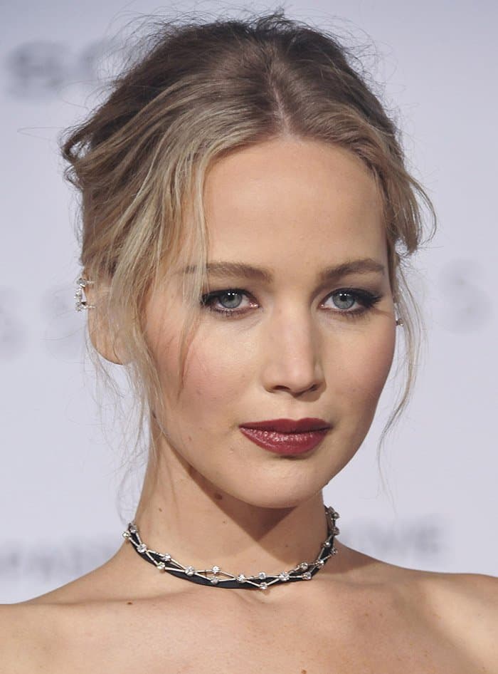 Jennifer Lawrence completes her '90s-inspired look with a bold black choker