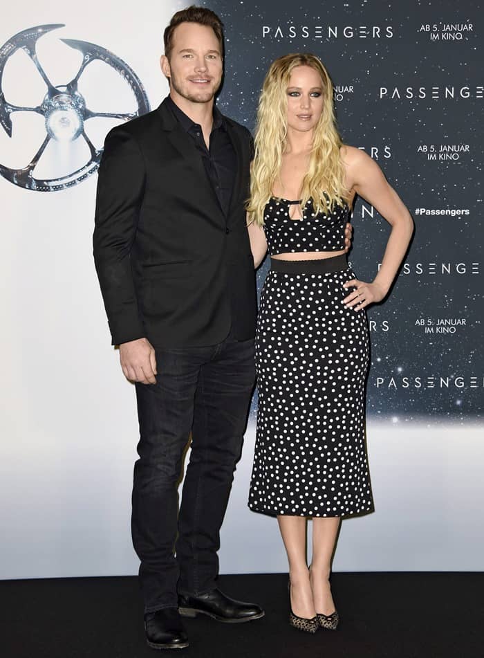 Jennifer Lawrence and Chris Pratt pose together at the Berlin Passengers photocall, where her midi-length polka-dot separates leave her Christian Louboutin Neoalto pumps fully visible