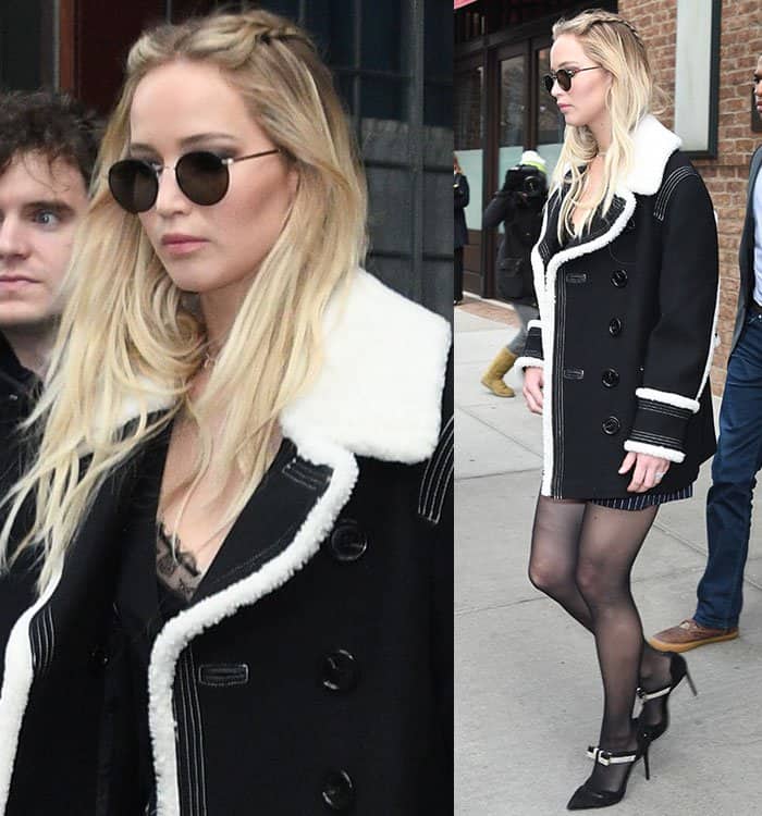 Jennifer Lawrence styled her blonde hair in loose waves, with two front braids adding a subtle boho touch to her chic ensemble