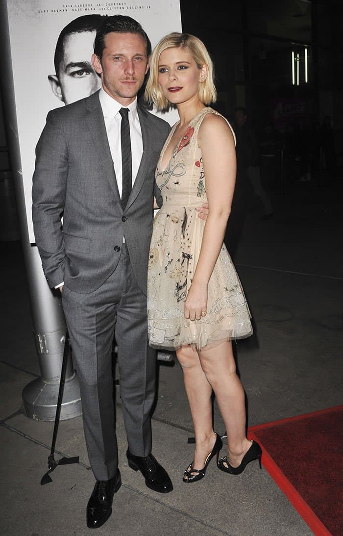 Kate Mara dazzles in a nude, intricately embroidered Christian Dior dress paired with edgy Christian Louboutin "Cagouletta" pumps at the Man Down premiere, alongside Jamie Bell in a sleek gray suit