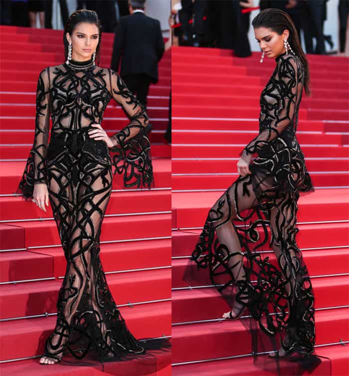 Kendall Jenner commands attention in a daring, sheer black gown with intricate detailing, turning heads on the red carpet at the Cannes Film Festival