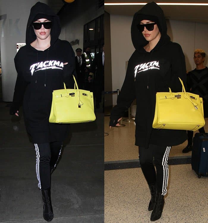 Khloé Kardashian styled her Adidas track pants with a hoodie and Yeezy mesh ankle boots
