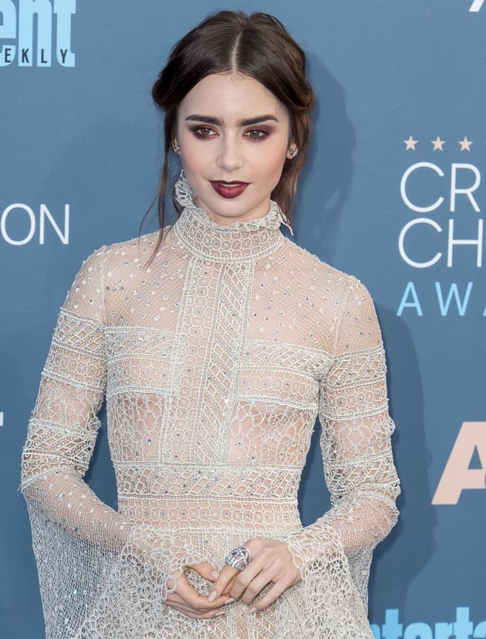 Lily Collins exudes elegance in a Victorian-inspired, sheer lace gown by Elie Saab, styled with Chanel jewelry