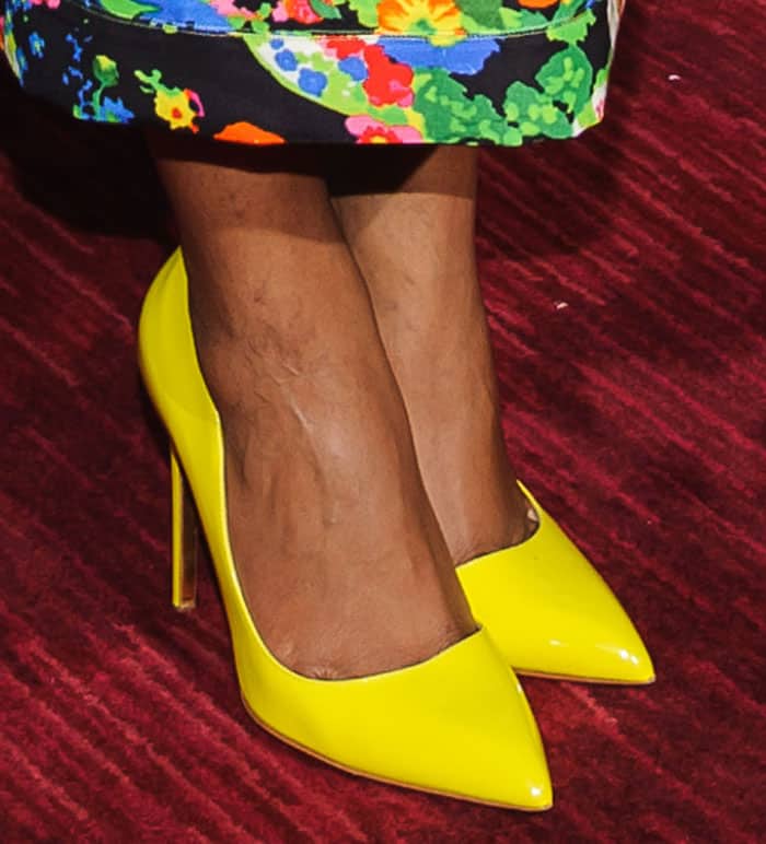 Naomie Harris brightens the red carpet in vivid yellow Rupert Sanderson Elba pumps, the sharp pointed toes and slender stiletto heels adding a sleek, leg-lengthening finish to her floral Rosie Assoulin dress