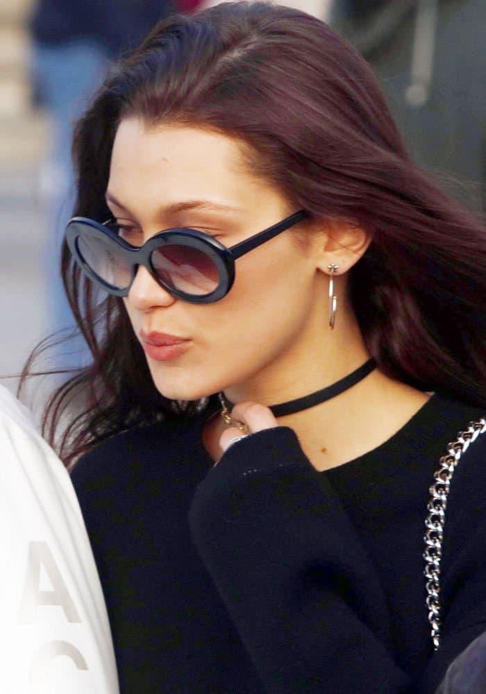 Bella Hadid in Paris wearing oversized sunglasses and a black choker