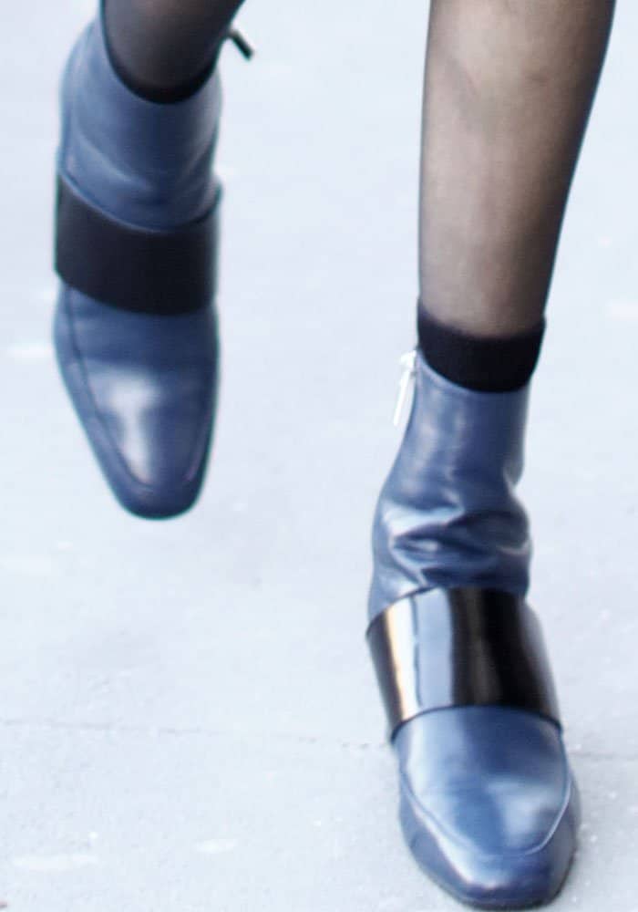 Bella Hadid tours Paris in sleek Aska Goldie boots in navy blue leather