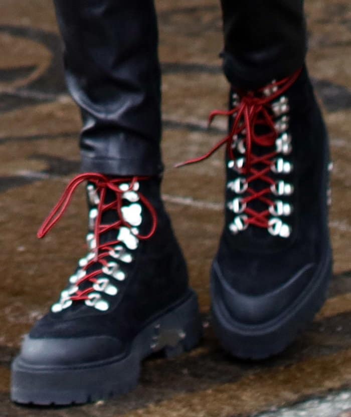 Close-up of Bella Hadid's Off-White hiking boots with colored laces and metal spur accents, worn during her shopping spree in Paris