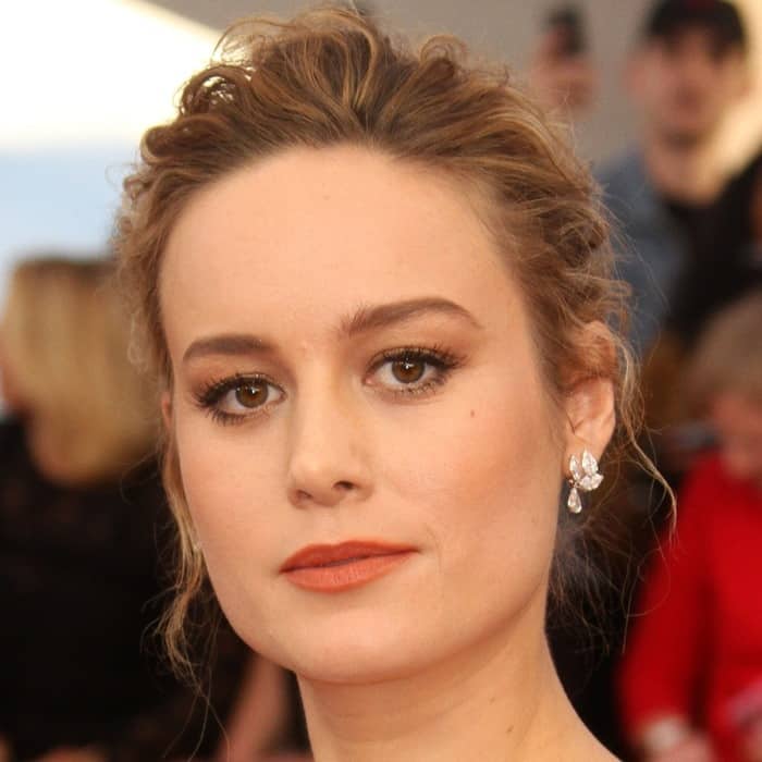 Brie Larson completed her elegant look with a soft, textured updo and sparkling Repossi drop earrings