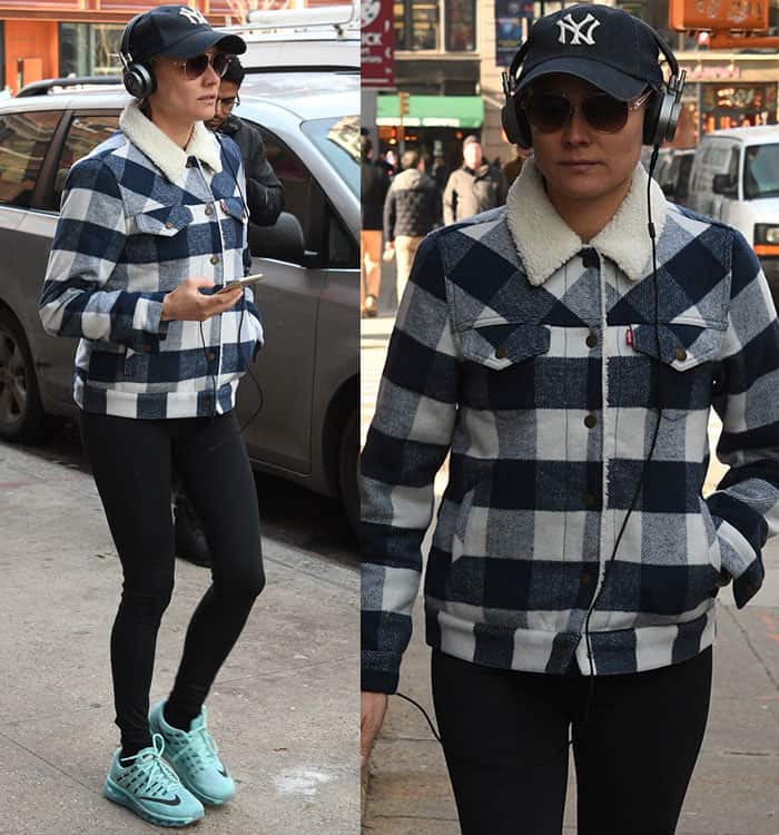 Diane Kruger steps out in New York City on January 16, 2017, wearing a Levi’s wool boyfriend sherpa trucker jacket in peacoat plaid and a New York Yankees baseball cap