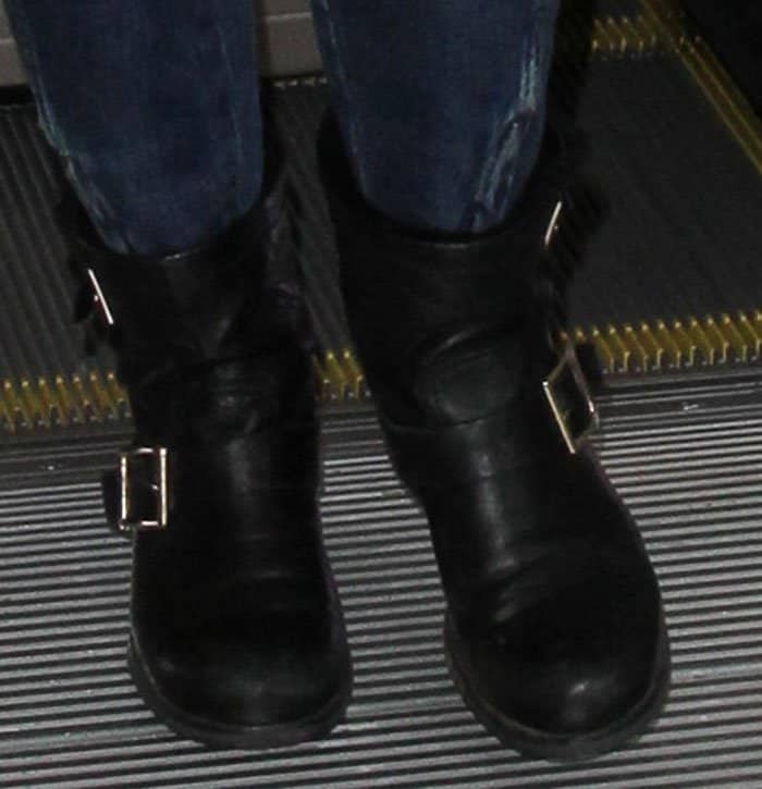 Elizabeth Banks completed her look with Jimmy Choo "Youth" biker boots, featuring buckled straps, round toes, and rugged soles for a stylish yet practical finish