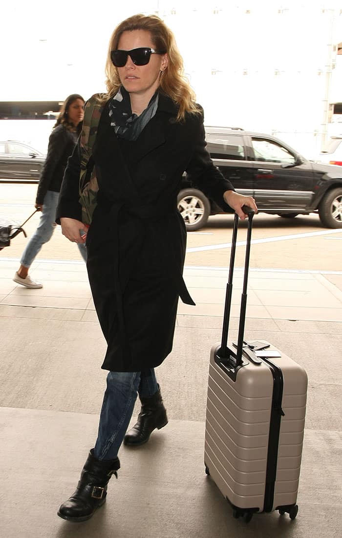 Elizabeth Banks was spotted pulling her sleek beige suitcase through LAX