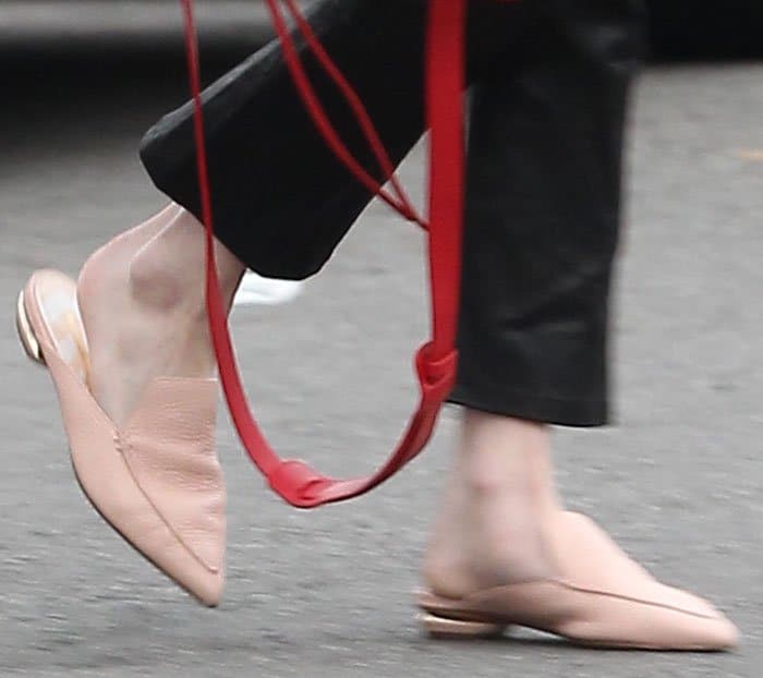 Emma Roberts shows off her effortlessly chic style in blush-colored Nicholas Kirkwood mules