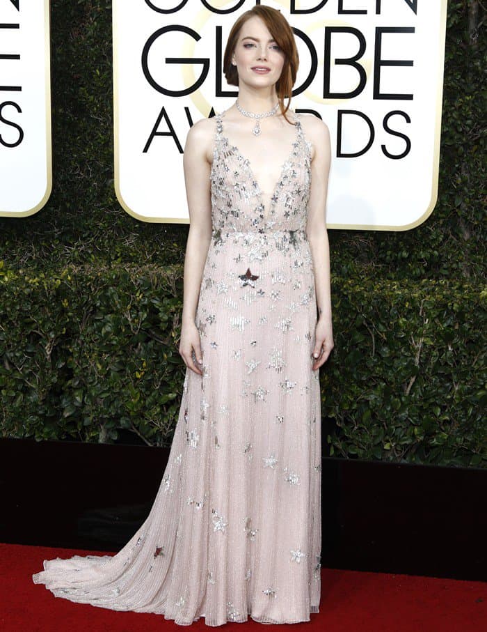 Emma Stone was the embodiment of elegance at the 2017 Golden Globe Awards, donning a stunning Valentino Couture gown adorned with silver star details that dazzled onlookers