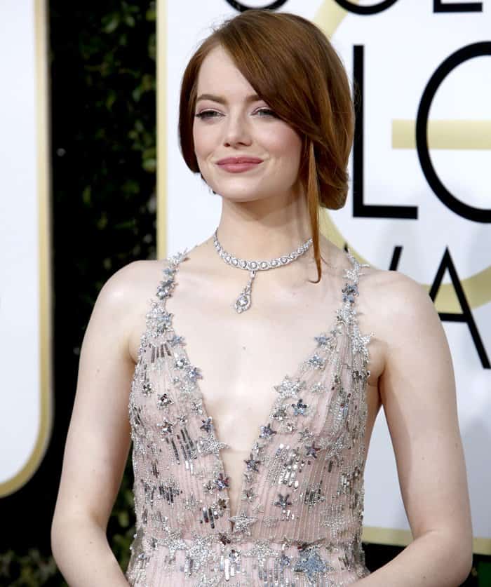 Emma Stone paired her celestial Valentino Couture gown with an archival-inspired Tiffany Co. diamond necklace that echoed the shimmer of the silver star embroidery