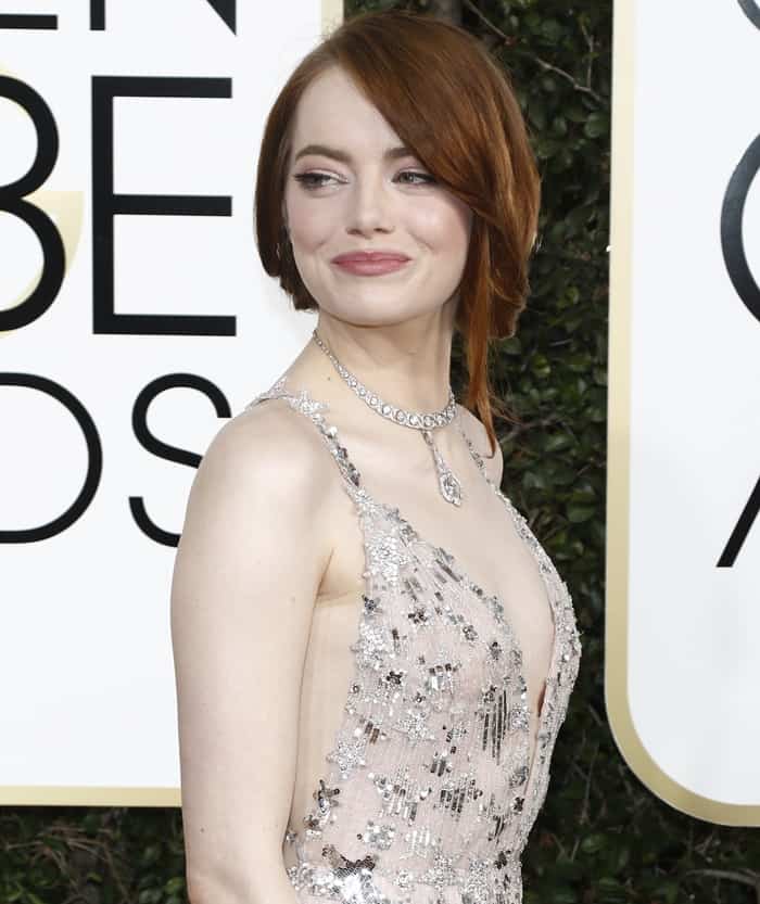 A relaxed updo and softly framed tendrils kept Emma Stone’s Golden Globes beauty look understated and romantic